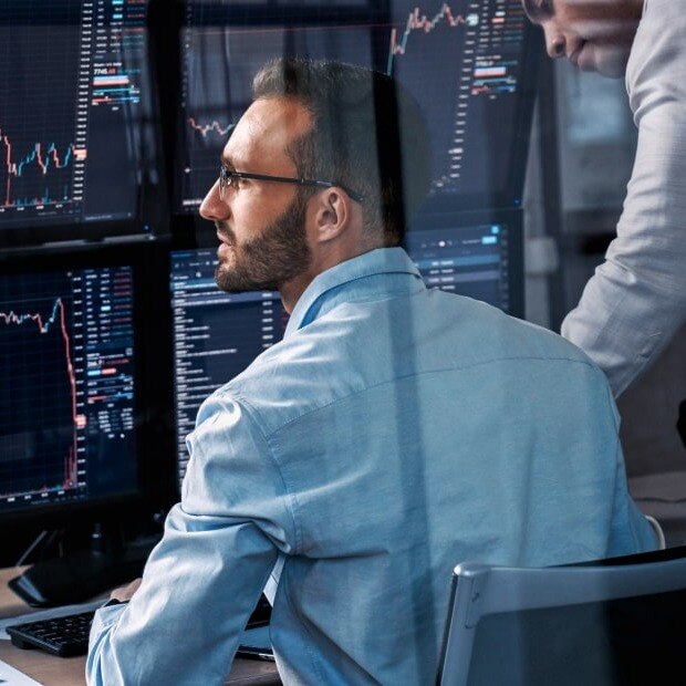 Man in office trading futures Man in office trading futures